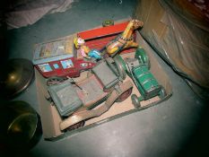 A box of tin plate dolls.