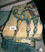 A quantity of rugs/wall hangings.