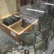 A wooden case of magic lantern slides.