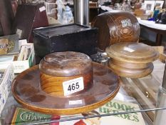 3 wooden boxes and a wooden barrel.