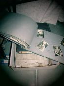 A box of old photographs and negatives.