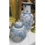 A blue and white vase and a ginger jar.