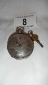 An early 20th century silver pocket watch with silvered dial in box, stamped fine silver,