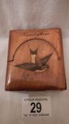 An old wooden pocket watch stand inlaid with a swallow and inscribed 'Bordighera' (slight chip on