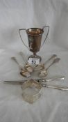 A hall marked silver trophy and other items of silver including spoons, napkin ring etc.