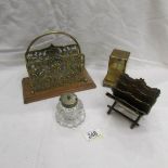 2 brass letter racks, a brass money box and a glass inkwell.