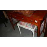 A 3 drawer mahogany side table.