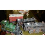 3 tin plate railway engines and a freight truck.