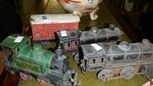 3 tin plate railway engines and a freight truck.