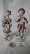 A pair of hand painted porcelain figures, 5.5" tall (no damage).