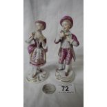 A pair of hand painted porcelain figures, 5.5" tall (no damage).