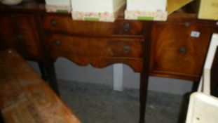 A mahogany sideboard.