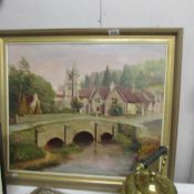 An oil on canvas village scene signed R B Underhill, 1874.