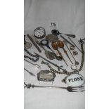 A mixed lot of interesting items including watch chains, silver plate,