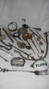 A mixed lot of interesting items including watch chains, silver plate,