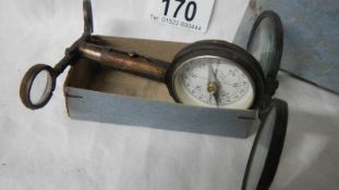 An original compass marked Depose' France, in original box.