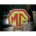 A metal MG plaque.