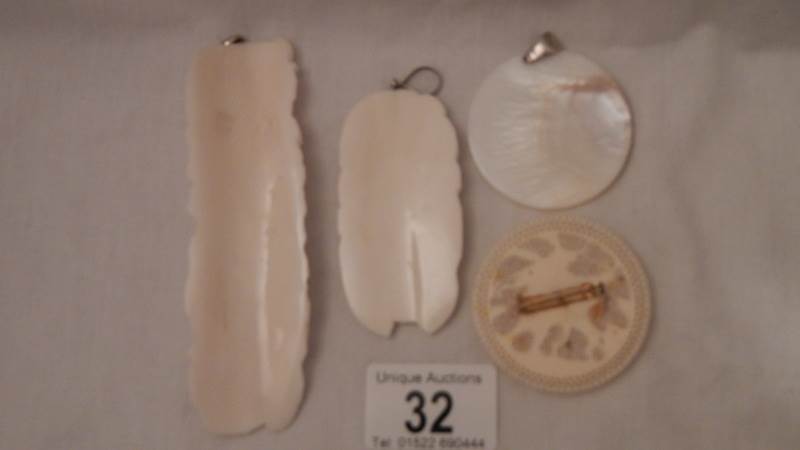4 interesting bone and mother of pearl pendants etc., depicting animals and female figures. - Image 4 of 4