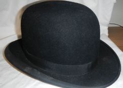 A bowler hat, half size.