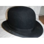 A bowler hat, half size.