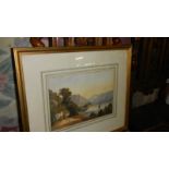 A framed and glazed watercolour depicting mountains signed S Campbell '46.