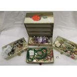 A mixed lot of costume jewellery in a card 4 drawer chest.