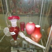 A quantity of cranberry and other glass ware.