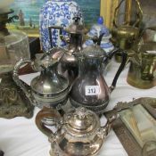 3 silver plate coffee pots, a silver plate teapot and a brass teapot stand.