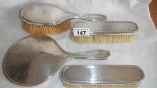 A 4 piece hall marked silver dressing table set.