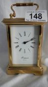 A good 20th century brass carriage clock with open glass top and sides by Rapport, London,