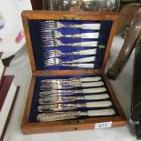 A cased set of fish knives and forks.