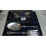 2 cased silver plate spoons and forks.