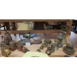 A shelf of brass weights, iron weights and flat irons.