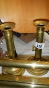 A pair of brass candlesticks.