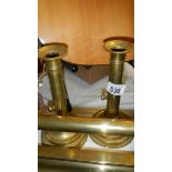 A pair of brass candlesticks.