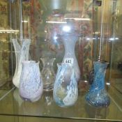 A quantity of coloured glass vases.