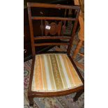 A mahogany inlaid nursing chair.