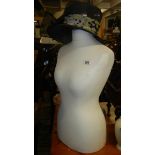 A Mannikin torso and vintage hat.