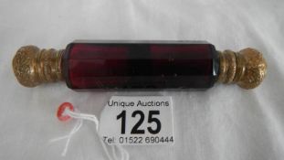 A ruby glass double ended scent bottle, one cap a/f.