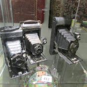 3 vintage folding camera's.