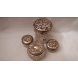 4 early 20th century sillver topped dressing table pots, all hall marked and in fair condition.