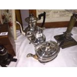 A silver plate teapot, coffee pot and water jug.