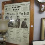 A framed and glazed Mersey Beat poster featuring the Beatles.