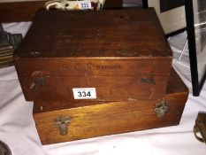 2 wooden boxes containing scientific/medical instruments.