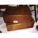 2 wooden boxes containing scientific/medical instruments.