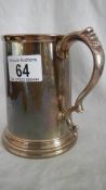 A hall marked silver tankard with dedication and glass bottom approximately 15 ounces.