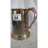 A hall marked silver tankard with dedication and glass bottom approximately 15 ounces.