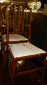 A pair of mahogany inlaid bedroom chairs (seat need recovering).