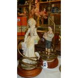 A pair of figural table lamps.