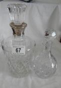 A good quality glass decanter with silver collar and one other.